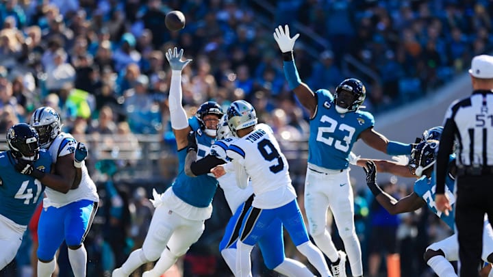Carolina Panthers quarterback Bryce Young (9) touchback as Jacksonville Jaguars defensive end Roy Robertson-Harris (95) and linebacker Foyesade Oluokun (23) defend during the first quarter of a regular season NFL football matchup Sunday, Dec. 31, 2023 at EverBank Stadium in Jacksonville, Fla. The Jacksonville Jaguars blanked the Carolina Panthers 26-0. Carolina Panthers quarterback Bryce Young (9) touchback as Jacksonville Jaguars defensive end Roy Robertson-Harris (95) and linebacker Foyesade Oluokun (23) defend during the first quarter of a regular season NFL football matchup Sunday, Dec. 31, 2023 at EverBank Stadium in Jacksonville, Fla. The Jacksonville Jaguars blanked the Carolina Panthers 26-0.