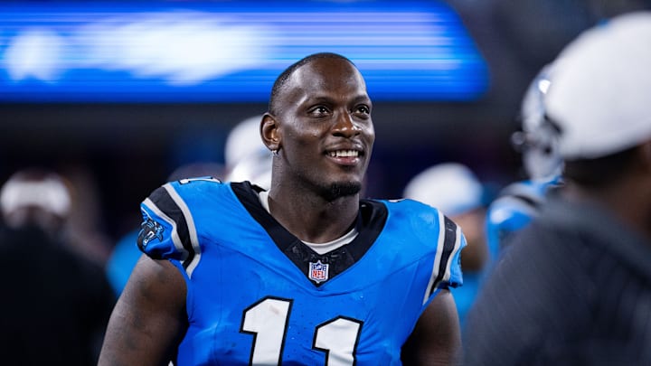 Aug 8, 2025; Charlotte, North Carolina, USA; Carolina Panthers linebacker Nic Scourton (11) walks the sideline during the third quarter against the Cleveland Browns at Bank of America Stadium. 