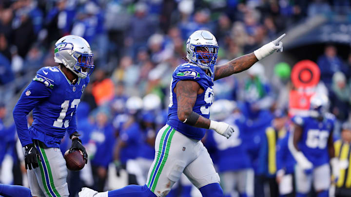 Nov 30, 2025; Seattle, Washington, USA; Seattle Seahawks defensive end Leonard Williams (99) reacts after an interception during the second half against the Minnesota Vikings at Lumen Field. 