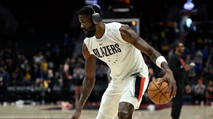 Portland, Oregon, USA; Portland Trail Blazers center Deandre Ayton (2) warms up before a game against the Golden State Warriors at Moda Center. Mandatory Credit: Troy Wayrynen-USA TODAY Sports.