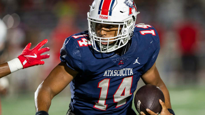Atascocita quarterback Cardae Mack carries.