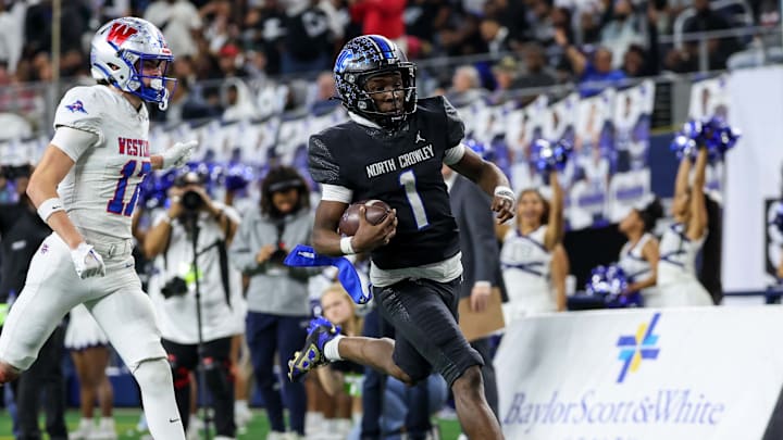 Running back Cornelius Warren III of North Crowley scores on a 75-yard run during the third quarter of the Texas 6A Division 1 state championship game at AT&T Stadium.