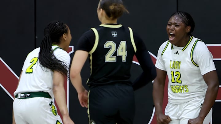 Ontario Christian's Tati Griffin (12) and Dani Robinson enjoy a moment during their team's 61-44 win over Archbishop Mitty in the 4th Sabrina Ionecus Showcase in Concord