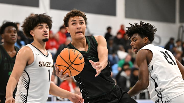 St. Joseph's junior Julius Price scoops the ball between Alvin Loving and Carlton Perrialliat en route to his 16-point night in the Crush in the Valley Showscase 1-24-25