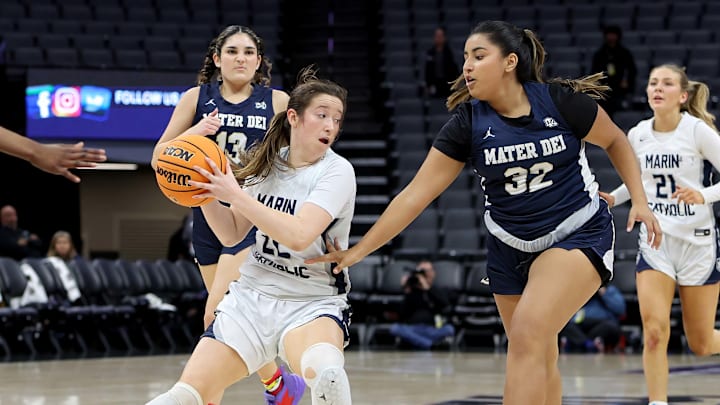 Izzy McFadden (left) of Marin Catholic is guarded by Mater Dei Catholic's Ana Karen Lacave during the California (CIF) State Division 3 title game.