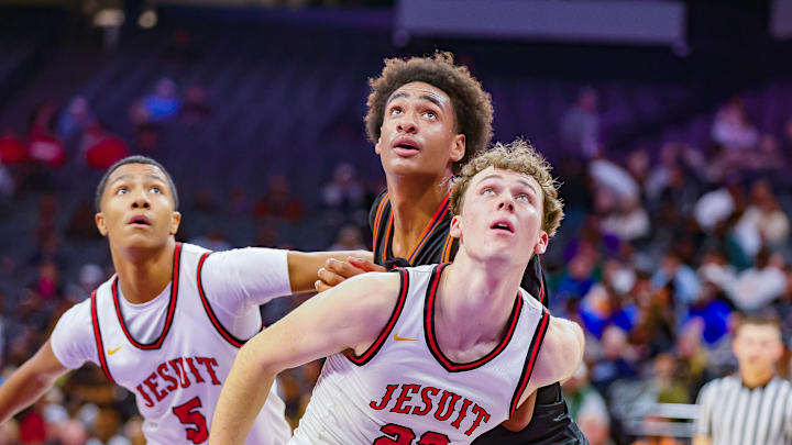 Jesuit's Asher Schroeder (22) and Maison Phillips (5) blocks out Chatsworth's Alijah Arenas during California (CIF) State Division 2 title game.