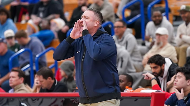 Brewster Academy head coach Jason Smith yells instructions to his players during the quarterfinals of the 2025 Chipotle Nationals in Indiana.