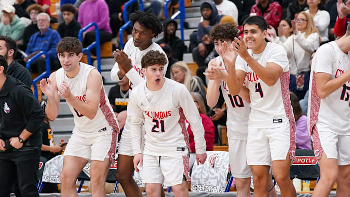 Columbus players cheer from the bench during the championship game of the 2025 Chipotle Nationals in Indiana.
