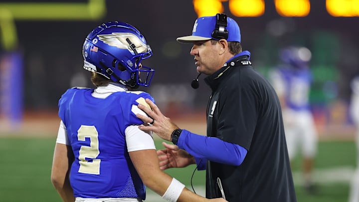 Carson Palmer (right) talks to Santa Margarita QB Trace Johnson during the CIF State Open Division final against De La Salle at Saddleback College.