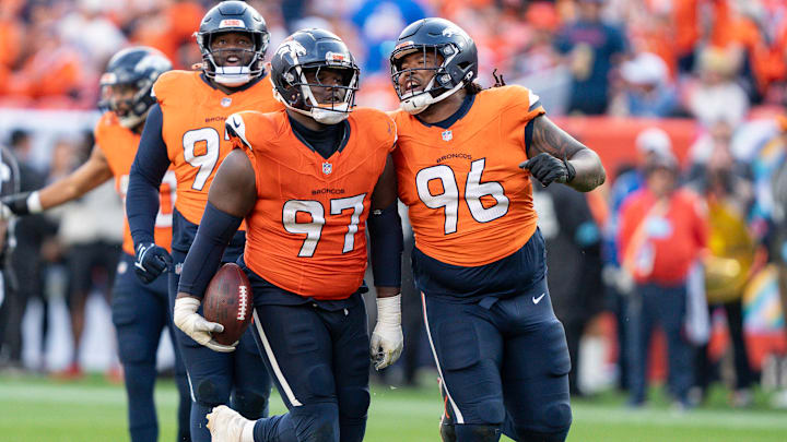 October 13, 2024: Denver Broncos defensive tackle Malcolm Roach (97) celebrates his fumble recovery with teammate Denver Broncos defensive end Eyioma Uwazurike (96) in the second half of the football game between the Denver Broncos and Los Angeles Chargers. The play was wiped out by a defensive holding call. October 13, 2024: Denver Broncos defensive tackle Malcolm Roach (97) celebrates his fumble recovery with teammate Denver Broncos defensive end Eyioma Uwazurike (96) in the second half of the football game between the Denver Broncos and Los Angeles Chargers. The play was wiped out by a defensive holding call.