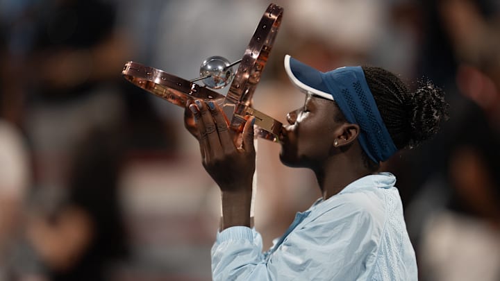 Victoria Mboko lifts the National Bank Open trophy.