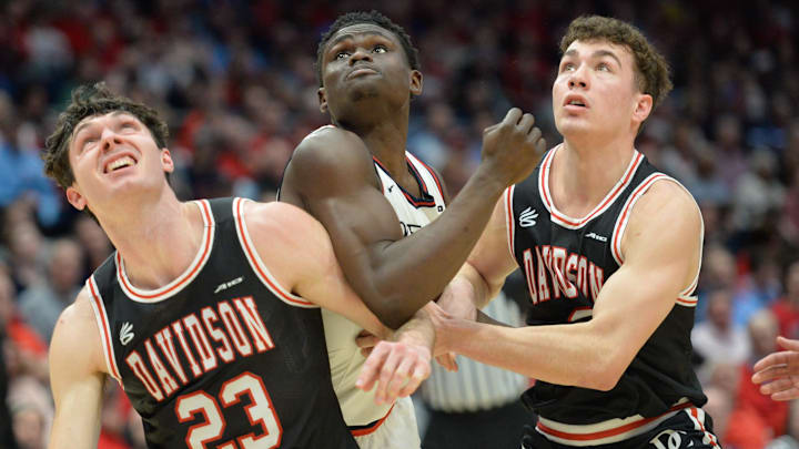 Feb 27, 2024; Dayton, Ohio, USA;  Davidson Wildcats guard Connor Kochera (23) battles for a rebound against Dayton. 