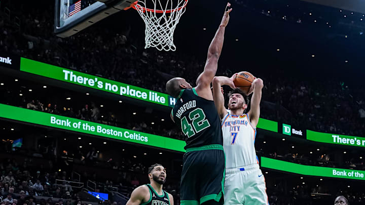 Mar 12, 2025; Boston, Massachusetts, USA; Boston Celtics center Al Horford (42) defends against Oklahoma City Thunder forward Chet Holmgren (7) in the third quarter at TD Garden. Mandatory Credit: David Butler II-Imagn Images