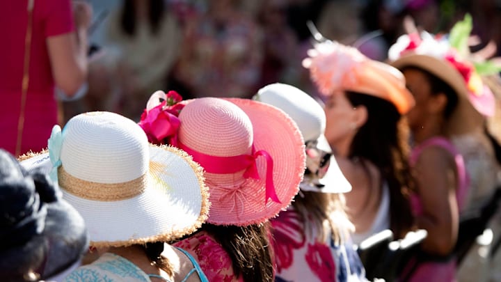 Women wait to compete in the hat contest Saturday at Kentucky Derby on Worth.