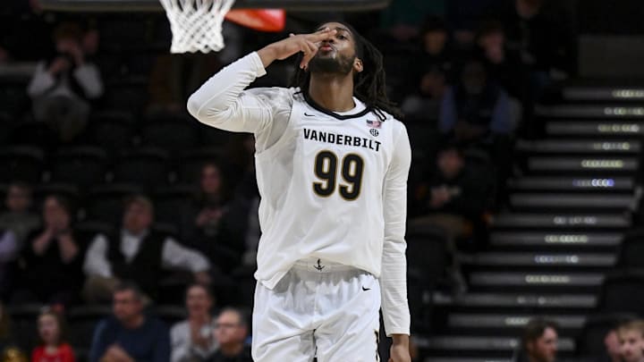 Dec 29, 2025; Nashville, Tennessee, USA; Vanderbilt Commodores forward Devin McGlockton (99) reacts after a made three point basket against the New Haven Chargers during the second half at Memorial Gymnasium. Mandatory Credit: Steve Roberts-Imagn Images Dec 29, 2025; Nashville, Tennessee, USA; Vanderbilt Commodores forward Devin McGlockton (99) reacts after a made three point basket against the New Haven Chargers during the second half at Memorial Gymnasium. Mandatory Credit: Steve Roberts-Imagn Images