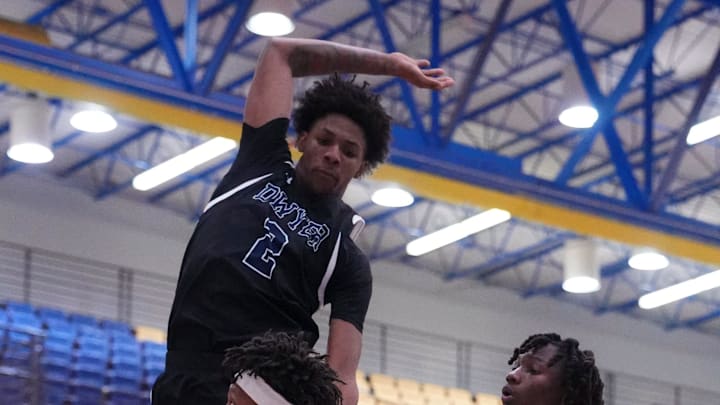 Martin County's Brandon Brazell (4) fakes the shot against Jermuni Shuler (2) of Dwyer in a high school basketball game on Wednesday, January 8, 2025 at Martin County High School in Stuart.