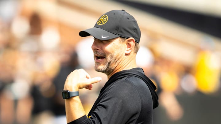 Aug 9, 2025; Iowa offensive coordinator and quarterbacks coach Tim Lester talks with players during the Hawkeyes Kids Day NCAA football open practice at Kinnick Stadium in Iowa City, Iowa. Mandatory Credit: Joseph Cress for the Des Moines Register