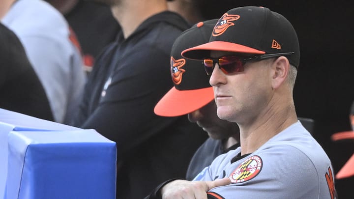 Jul 22, 2025; Cleveland, Ohio, USA; Baltimore Orioles interim manager Tony Mansolino (36) stands in the dugout in the third inning against the Cleveland Guardians at Progressive Field. Mandatory Credit: David Richard-Imagn Images