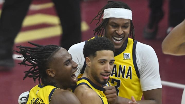 May 6, 2025; Cleveland, Ohio, USA; Indiana Pacers guard Tyrese Haliburton (center) celebrates the game-winning three-point basket with forward Aaron Nesmith (23) and center Myles Turner (33) after game two of the second round of the 2025 NBA Playoffs against the Cleveland Cavaliers at Rocket Arena. Mandatory Credit: David Richard-Imagn Images