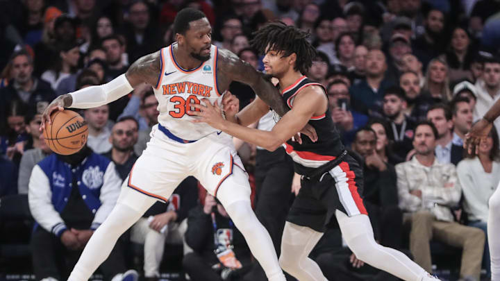 Jan 9, 2024; New York, New York, USA; New York Knicks forward Julius Randle (30) looks to post up against Portland Trail Blazers guard Shaedon Sharpe (17) in the first quarter at Madison Square Garden. Mandatory Credit: Wendell Cruz-Imagn Images