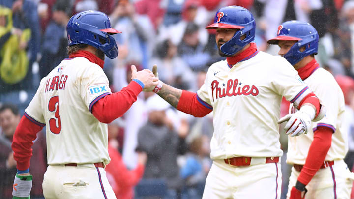 Apr 6, 2025; Philadelphia, Pennsylvania, USA; Philadelphia Phillies outfielder Nick Castellanos (8) celebrates his grand slam with first base Bryce Harper (3).