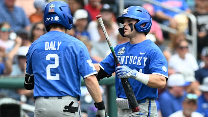 Jun 19, 2024; Omaha, NE, USA;  Kentucky Wildcats second baseman …milien Pitre (4) celebrates a home run with third baseman Mitchell Daly (2) against the Florida Gators during the fifth inning at Charles Schwab Field Omaha. Mandatory Credit: Steven Branscombe-Imagn Images