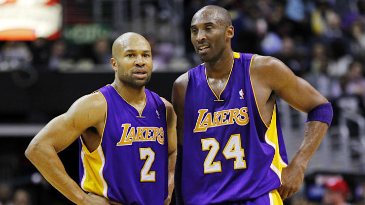 March 7, 2012; Washington, DC, USA; Los Angeles Lakers point guard Derek Fisher (2) talks with shooting guard Kobe Bryant (24) against the Washington Wizards in the first half at Verizon Center. The Wizards won 106-101. Mandatory Credit: Geoff Burke-Imagn Images March 7, 2012; Washington, DC, USA; Los Angeles Lakers point guard Derek Fisher (2) talks with shooting guard Kobe Bryant (24) against the Washington Wizards in the first half at Verizon Center. The Wizards won 106-101. Mandatory Credit: Geoff Burke-Imagn Images