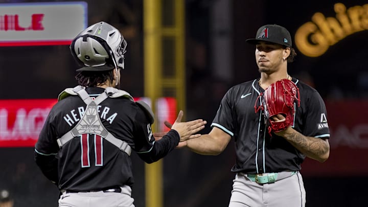 Sep 3, 2024; San Francisco, California, USA; Arizona Diamondbacks catcher Jose Herrera (11) and pitcher Justin Martinez (63) celebrate their team’s 8-7 win over the San Francisco Giants at Oracle Park. Mandatory Credit: John Hefti-Imagn Images Sep 3, 2024; San Francisco, California, USA; Arizona Diamondbacks catcher Jose Herrera (11) and pitcher Justin Martinez (63) celebrate their team’s 8-7 win over the San Francisco Giants at Oracle Park. Mandatory Credit: John Hefti-Imagn Images