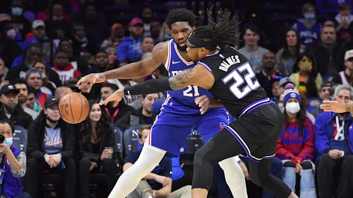 Jan 29, 2022; Philadelphia, Pennsylvania, USA; Sacramento Kings center Richaun Holmes (22) knocks the ball away from Philadelphia 76ers center Joel Embiid (21) during the first quarter at Wells Fargo Center. Mandatory Credit: Eric Hartline-Imagn Images