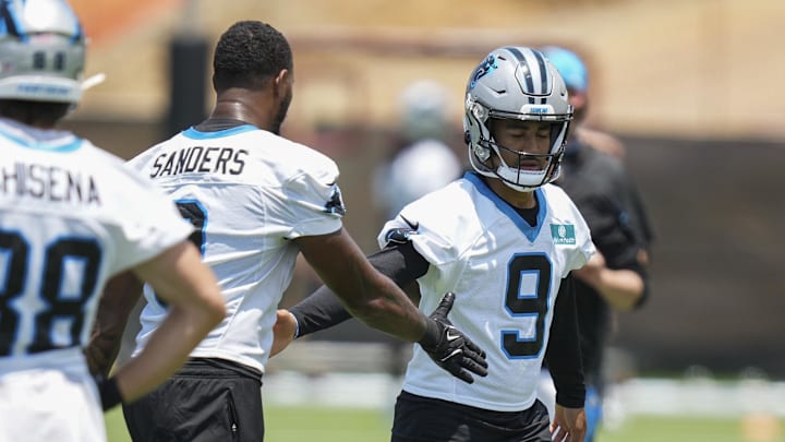Jun 11, 2025; Charlotte, NC, USA; Carolina Panthers quarterback Bryce Young (9) high fives with Carolina Panthers tight end Ja'Tavion Sanders (0) during minicamp at Bank of America Stadium. Mandatory Credit: Jim Dedmon-Imagn Images