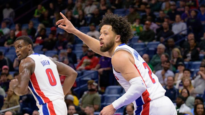 Mar 17, 2025; New Orleans, Louisiana, USA;  Detroit Pistons guard Cade Cunningham (2) reacts after a score next to center Jalen Duren (0) during the first half against the New Orleans Pelicans at Smoothie King Center. Mandatory Credit: Matthew Hinton-Imagn Images