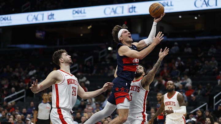 Jan 7, 2025; Washington, District of Columbia, USA; Washington Wizards forward Corey Kispert (24) shoots the ball as Houston Rockets center Alperen Sengun (28) and Rockets guard Fred VanVleet (5) defend in the second quarter at Capital One Arena. Mandatory Credit: Geoff Burke-Imagn Images Jan 7, 2025; Washington, District of Columbia, USA; Washington Wizards forward Corey Kispert (24) shoots the ball as Houston Rockets center Alperen Sengun (28) and Rockets guard Fred VanVleet (5) defend in the second quarter at Capital One Arena. Mandatory Credit: Geoff Burke-Imagn Images