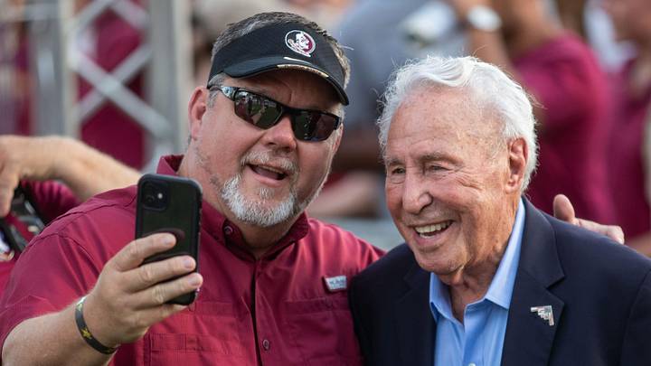 Lee Corso, former Florida State quarterback who recently retired from College GameDay, poses for photos with fans at the FSU game against Miami on Saturday, Oct. 4, 2025.