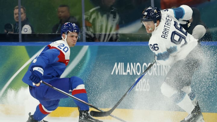 Feb 11, 2026; Milan, Italy; Mikko Rantanen of Finland in action with Juraj Slafkovsky of Slovakia in men's ice hockey group B play during the Milano Cortina 2026 Olympic Winter Games at Milano Santagiulia Ice Hockey Arena. Mandatory Credit: Geoff Burke-Imagn Images