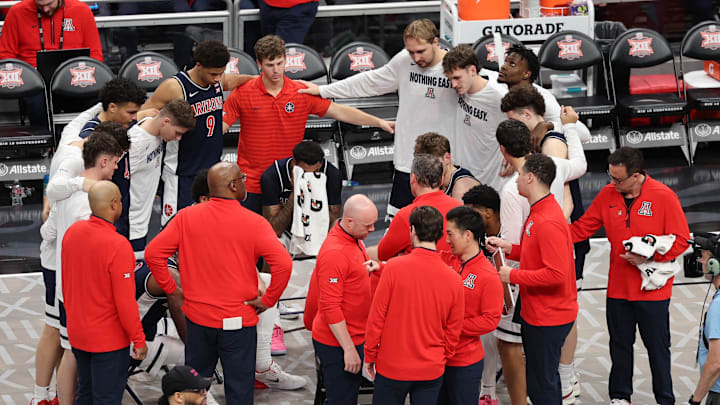 Mar 15, 2025; Kansas City, MO, USA; The Arizona Wildcats huddle up during a time out against the Houston Cougars during the second half for the Big 12 Conference Tournament Championship game at T-Mobile Center. Mandatory Credit: William Purnell-Imagn Images