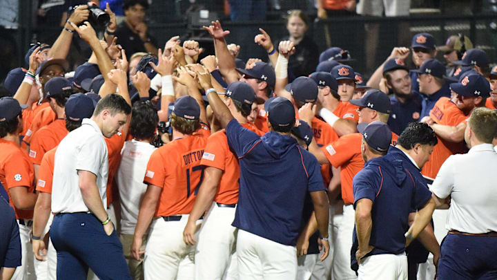 Auburn players celebrate winning their NCAA Regional Baseball Tournament at Plainsman Park in Auburn, Ala., on Sunday June 1, 2025.