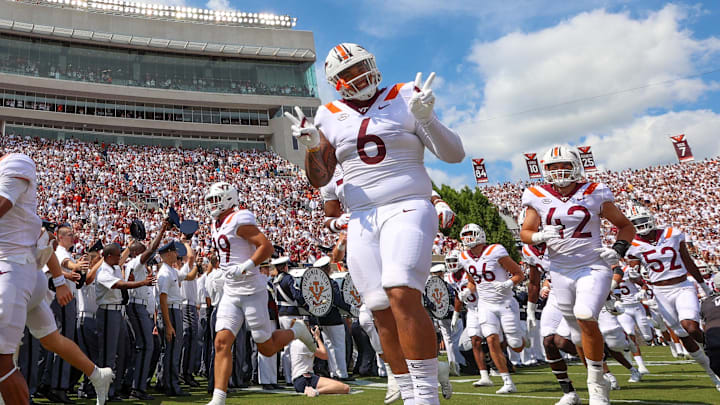 Sep 11, 2021; Blacksburg, Virginia, USA; Virginia Tech Hokies defensive lineman Josh Fuga (6) poses during the team s entrance before the start of the Virginia Tech Hokies and Middle Tennessee Blue Raiders football game at Lane Stadium. Mandatory Credit: Ryan Hunt-Imagn Images Sep 11, 2021; Blacksburg, Virginia, USA; Virginia Tech Hokies defensive lineman Josh Fuga (6) poses during the team s entrance before the start of the Virginia Tech Hokies and Middle Tennessee Blue Raiders football game at Lane Stadium. Mandatory Credit: Ryan Hunt-Imagn Images