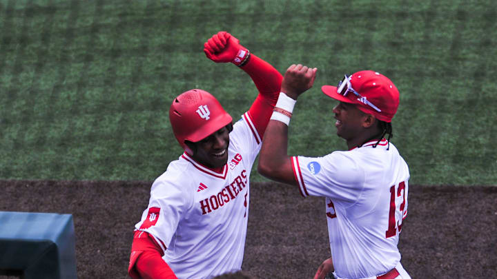 Indiana's Devin Taylor (5) and Indiana's Andrew Wiggins (13) celebrate after Taylor hits a home run during a NCAA Baseball Tournament Knoxville Regional game at Lindsey Nelson Stadium on Sunday, June 2, 2024 in Knoxville, Tenn.