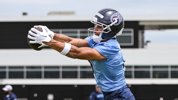 May 10, 2025; Nashville, TN, USA;  Tennessee Titans wider receiver Elic Ayomanor (5) makes a catch as he goes through drills during Rookie Mini Camp at Saint Thomas Sports Park. Mandatory Credit: Steve Roberts-Imagn Images