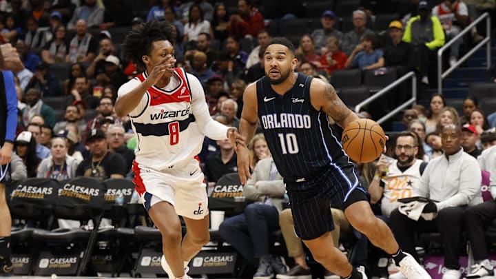 Apr 3, 2025; Washington, District of Columbia, USA; Orlando Magic guard Cory Joseph (10) drives to the basket as Washington Wizards guard Bub Carrington (8) defends in the first half at Capital One Arena. Mandatory Credit: Geoff Burke-Imagn Images