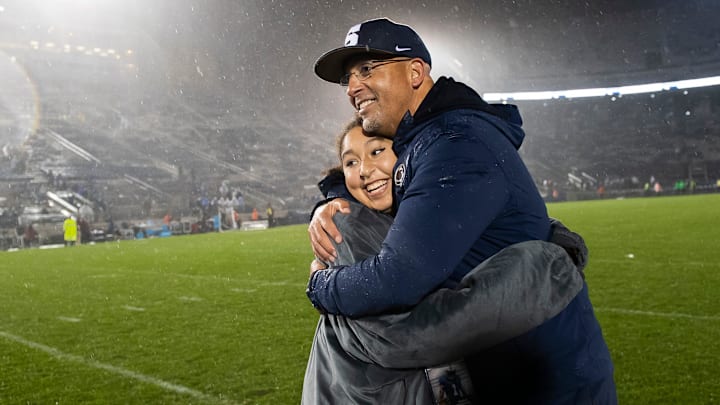 Penn State head football coach James Franklin hugs his daughter, Shola Franklin, following a game against Massachusetts on Saturday, Oct.14, 2023, in State College, Pennsylvania. The Nittany Lions won, 63-0.