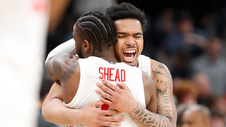 Houston's Jamal Shead (1) and Ramon Walker Jr. (3) celebrate after Houston defeated Texas A&M in the second round of the NCAA Tournament. 