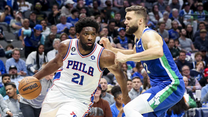 Mar 2, 2023; Dallas, Texas, USA;  Philadelphia 76ers center Joel Embiid (21) drives to the basket past Dallas Mavericks forward Maxi Kleber (42) during the second half at American Airlines Center. Mandatory Credit: Kevin Jairaj-Imagn Images