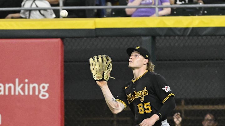 Jul 12, 2024; Chicago, Illinois, USA;  Pittsburgh Pirates outfielder Jack Suwinski (65) catches a fly ball hit by Chicago White Sox catcher Korey Lee (26) during the seventh inning at Guaranteed Rate Field. Mandatory Credit: Matt Marton-Imagn Images