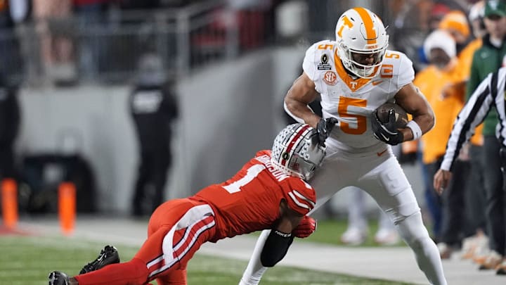 Tennessee wide receiver Bru McCoy (5) is grabbed by Ohio State cornerback Davison Igbinosun (1) during an NCAA college football playoff game on Saturday, Dec. 21, 2024, in Columbus, Ohio. Tennessee wide receiver Bru McCoy (5) is grabbed by Ohio State cornerback Davison Igbinosun (1) during an NCAA college football playoff game on Saturday, Dec. 21, 2024, in Columbus, Ohio.