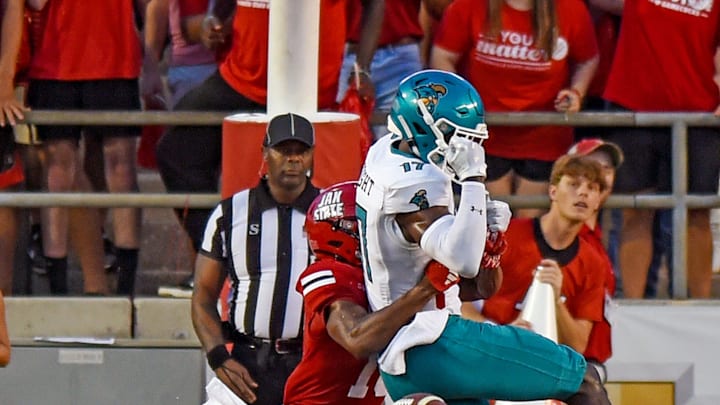 Coastal Carolina's Cameron Wright tries to make a catch as Jacksonville State's Zechariah Poyser breaks up the play during college football action at Burgess-Snow Field AmFirst Stadium in Jacksonville, Alabama August 29, 2024. (Dave Hyatt / Special to the Gadsden Times)
