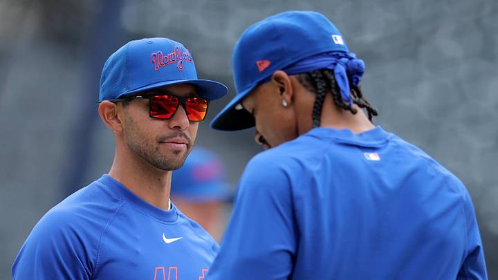 Apr 22, 2026; New York City, New York, USA; New York Mets bench coach Kai Correa (50) talks to shortstop Francisco Lindor (12) before a game against the Minnesota Twins at Citi Field. Mandatory Credit: Brad Penner-Imagn Images