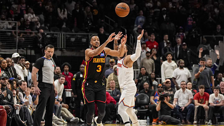 Apr 6, 2026; Atlanta, Georgia, USA; Atlanta Hawks guard CJ McCollum (3) makes a shot from beyond half court that would have tied the game but was after time expired against the New York Knicks during the second half at State Farm Arena. Mandatory Credit: Dale Zanine-Imagn Images