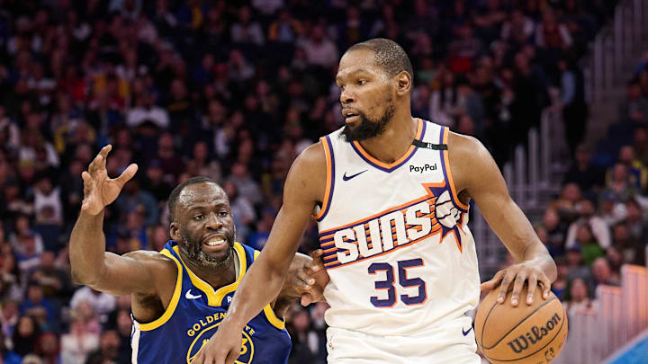 Dec 28, 2024; San Francisco, California, USA; Phoenix Suns forward Kevin Durant (35) controls the ball against Golden State Warriors forward Draymond Green (23) during the third quarter at Chase Center. Mandatory Credit: Robert Edwards-Imagn Images Dec 28, 2024; San Francisco, California, USA; Phoenix Suns forward Kevin Durant (35) controls the ball against Golden State Warriors forward Draymond Green (23) during the third quarter at Chase Center. Mandatory Credit: Robert Edwards-Imagn Images