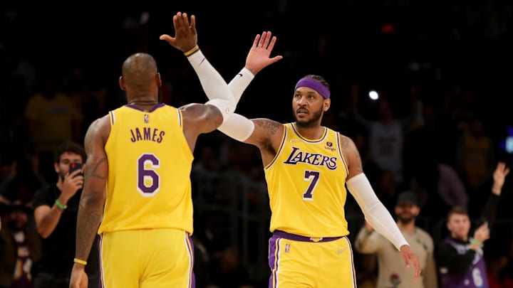 Los Angeles Lakers forward Carmelo Anthony high-fives teammate LeBron James on March 5, 2022.